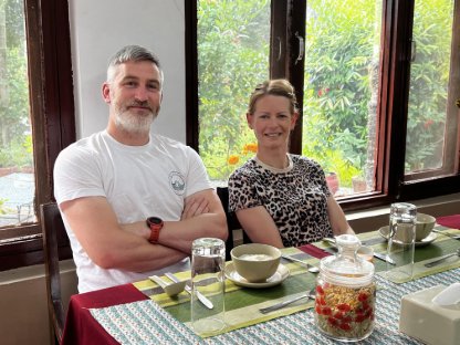 husband and wife travelled to nepal and having dinner